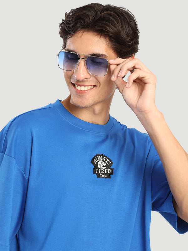Men Blue coloured Drop shoulder Oversized T Shirt with embroidery badge